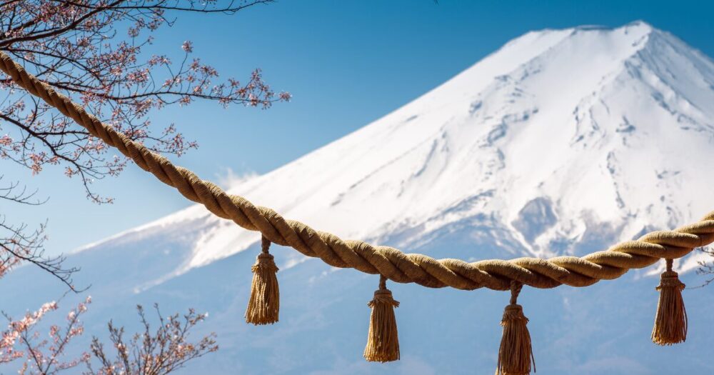 Mount Fuji and cherry blossoms, symbols of Japan, and shimenawa, a sacred rope that symbolizes the shrine